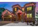 Two-story home with stone accents and three-car garage at 2627 Hillcroft Ln, Castle Rock, CO 80104