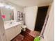 Functional bathroom with a modern vanity, toilet, and tiled walk-in shower at 5411 Chandler Way, Denver, CO 80239