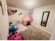 Comfortable bedroom with a carpeted floor, play tent and decorations at 5411 Chandler Way, Denver, CO 80239