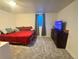 Comfortable bedroom featuring carpet, a window, and furniture at 5411 Chandler Way, Denver, CO 80239