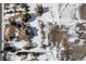 Aerial view of a house with large lot, snow covered at 7285 Sagebrush Dr, Parker, CO 80138