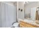 Simple bathroom with granite countertop and tub shower at 7285 Sagebrush Dr, Parker, CO 80138