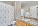 Clean bathroom with shower/tub combo and granite countertop at 7285 Sagebrush Dr, Parker, CO 80138