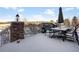 Deck with table, chairs, umbrella, and built-in grill at 7285 Sagebrush Dr, Parker, CO 80138