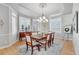 Elegant dining room with a chandelier and large windows at 7285 Sagebrush Dr, Parker, CO 80138