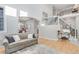 Bright and airy entryway with a grand staircase and hardwood floors at 7285 Sagebrush Dr, Parker, CO 80138