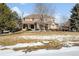 Two story house with stone accents and a large front yard at 7285 Sagebrush Dr, Parker, CO 80138