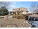 Two-story house exterior, stone accents, and landscaping at 7285 Sagebrush Dr, Parker, CO 80138