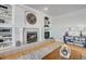 Gathering room with a fireplace and built-in shelving at 7285 Sagebrush Dr, Parker, CO 80138