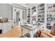 Functional home office with built-in shelves and a large desk at 7285 Sagebrush Dr, Parker, CO 80138