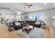 Spacious living room features a large sectional sofa, fireplace, and kitchen views at 7285 Sagebrush Dr, Parker, CO 80138