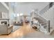 Spacious living room with hardwood floors, fireplace and high ceilings at 7285 Sagebrush Dr, Parker, CO 80138