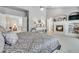 Relaxing main bedroom with fireplace, built-in shelving and sitting area at 7285 Sagebrush Dr, Parker, CO 80138