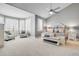 Bright main bedroom with high ceiling, plush carpet, and seating area at 7285 Sagebrush Dr, Parker, CO 80138