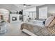 Spacious main bedroom with fireplace, sitting area, and large windows at 7285 Sagebrush Dr, Parker, CO 80138