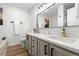 Bright bathroom with double sink vanity and wood-look floors and a soaking tub at 1129 W 112Th Ave # C, Denver, CO 80234