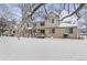 Snowy exterior shot showcases the townhome's architecture and winter landscape at 1129 W 112Th Ave # C, Denver, CO 80234