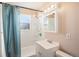 Cozy bathroom with a shower, vanity, and mirror at 1200 Newark St, Aurora, CO 80010