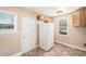 Bright kitchen featuring a white refrigerator and tiled floors at 1200 Newark St, Aurora, CO 80010