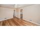 Inviting living room with hardwood floors, a ceiling fan, and an archway at 1200 Newark St, Aurora, CO 80010