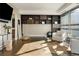 Bright fitness room with hardwood floors and wall shelving at 2800 E 2Nd Ave # 202, Denver, CO 80206