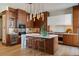 Spacious kitchen with modern wood cabinets, sleek island, and stainless steel appliances at 2800 E 2Nd Ave # 202, Denver, CO 80206