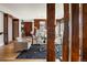 Stylish living room with wood columns, fireplace, and dark blue rug on hardwood floors at 2800 E 2Nd Ave # 202, Denver, CO 80206