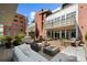 Spacious outdoor terrace with comfortable seating, fire pit, and lush landscaping at 2800 E 2Nd Ave # 202, Denver, CO 80206