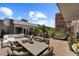 Relaxing rooftop deck with outdoor furniture and lush greenery at 2800 E 2Nd Ave # 202, Denver, CO 80206