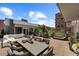 Expansive rooftop patio features outdoor lounge, dining furniture, and inviting views at 2800 E 2Nd Ave # 202, Denver, CO 80206
