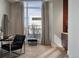 This bright sitting area features a vanity and a large window with serene views, creating a peaceful retreat at 2800 E 2Nd Ave # 202, Denver, CO 80206
