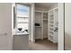 A well-organized walk-in closet offers ample storage with custom shelving and a built-in vanity space at 2800 E 2Nd Ave # 202, Denver, CO 80206