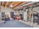 Unfinished basement with exposed beams, utilities, and room for storage or customization at 1000 Elmhurst Dr # B, Highlands Ranch, CO 80129