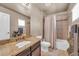 Well-lit bathroom features a single vanity and a shower-tub combo at 1000 Elmhurst Dr # B, Highlands Ranch, CO 80129