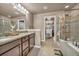 Spacious bathroom boasts double sinks, walk-in closet access, and separate shower and tub at 1000 Elmhurst Dr # B, Highlands Ranch, CO 80129