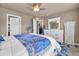 Comfortable bedroom with a ceiling fan, a large bed, and plenty of natural light at 1000 Elmhurst Dr # B, Highlands Ranch, CO 80129