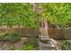 Beautiful brick facade and landscaped front entrance with stairs leading to the front door at 1000 Elmhurst Dr # B, Highlands Ranch, CO 80129