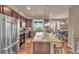 Spacious kitchen featuring granite countertops, stainless steel appliances, and a breakfast bar at 1000 Elmhurst Dr # B, Highlands Ranch, CO 80129