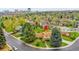 Aerial view of a charming home with lush landscaping and mature trees in a suburban neighborhood at 7076 S Spruce W Dr, Centennial, CO 80112