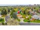 Aerial view showcasing a well-maintained home with a spacious backyard and mature landscaping at 7076 S Spruce W Dr, Centennial, CO 80112