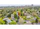 Aerial view of a lovely home in a mature neighborhood with manicured lawns and trees at 7076 S Spruce W Dr, Centennial, CO 80112