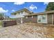 A brick and siding home exterior featuring a patio and hot tub for outdoor relaxation and enjoyment at 7076 S Spruce W Dr, Centennial, CO 80112