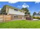 A spacious backyard with green lawn and a hot tub, great for relaxing and enjoying the outdoors at 7076 S Spruce W Dr, Centennial, CO 80112