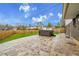 A beautiful backyard featuring a patterned concrete patio, well-manicured lawn and a hot tub at 7076 S Spruce W Dr, Centennial, CO 80112