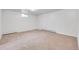 Spacious carpeted basement with a small window and a baseboard heater at 7076 S Spruce W Dr, Centennial, CO 80112