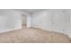 Bedroom with two windows, carpeted flooring, and two closets with doors at 7076 S Spruce W Dr, Centennial, CO 80112