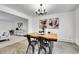 Bright dining room with stylish lighting and modern artwork on the walls at 7076 S Spruce W Dr, Centennial, CO 80112
