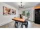 Bright dining room with stylish lighting and modern artwork on the walls at 7076 S Spruce W Dr, Centennial, CO 80112