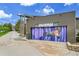 Fiddler's Green amphitheater exterior with modern design and mural on the garage door at 7076 S Spruce W Dr, Centennial, CO 80112
