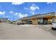 Starbucks exterior with drive-thru, outdoor seating, and convenient parking at 7076 S Spruce W Dr, Centennial, CO 80112